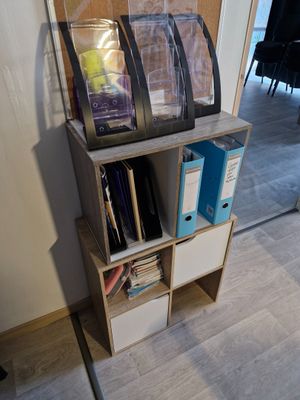 a book shelf with a bunch of books on top of it