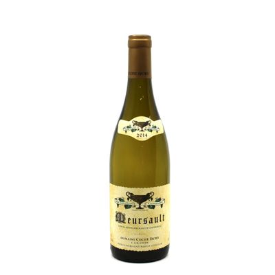 the bottle of wine is sitting on a white surface
