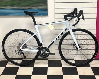 a bike that is sitting on a checkered floor