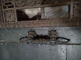 two monkeys that are sitting on a ledge in the bathroom