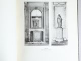 an open book with black and white images of a room and a fireplace
