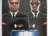 une affiche de cinéma pour « Men in Black », mettant en scène deux hommes en costume