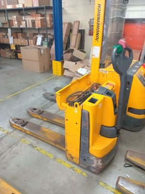 a forklift with a fork on it in a warehouse