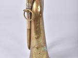 an old brass trumpet with a brass bell on a white background