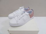 white and pink sneakers on a white box on a white surface