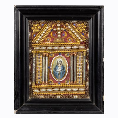a painting of the virgin of guadalupe in a black frame