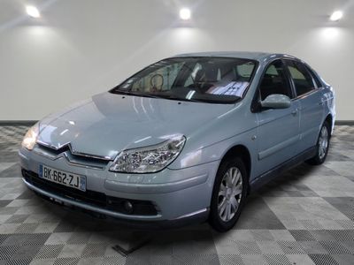 a picture of a blue car parked in a garage