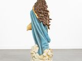statue of a woman with long brown hair and a blue robe