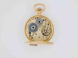 an antique pocket watch with a gold case and a blue dial