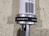 a close up of a metal object with a barcode on it