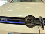 a white car with a blue stripe on the front of it
