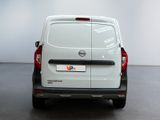 the rear end of a white van parked in a room