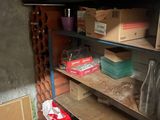 a shelf with boxes and other items on it in a room