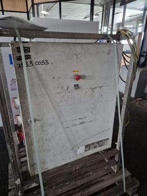 a white refrigerator sitting on a pallet in a warehouse
