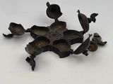 an image of a group of birds sitting on top of a metal object