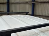 an image of a table with a metal top in a warehouse