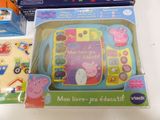 a box of pep the pig toys and a box of stickers