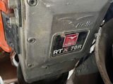 a close up of a motorcycle that is parked in a garage