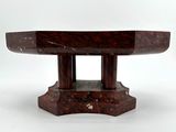 an image of a red marble table on a white background