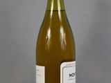 a bottle of wine that is sitting on a table