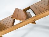 a wooden bench that has a book on top of it