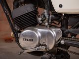 a close up of a motorcycle with a chain attached to it