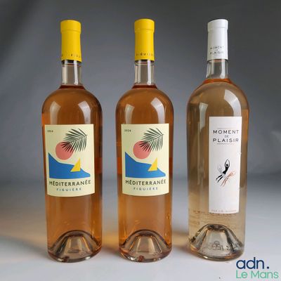 three bottles of wine sitting next to each other on a table