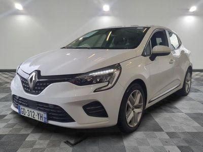 the white car is parked on a checkered floor in a garage