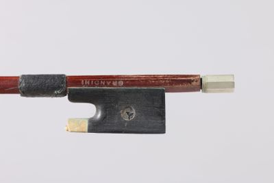 an image of a violin bow with a wooden handle on a white background