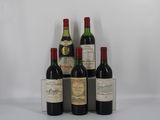 plusieurs bouteilles de vin sont alignées sur une surface blanche