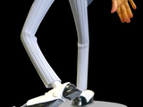 a figurine of a man in a suit and tie on a pedestal