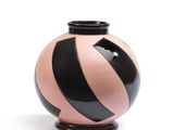 a black and pink vase with a black stripe on it