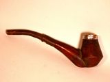 a pipe that is sitting on a table next to a wall