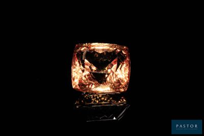 an orange diamond is shown in the dark