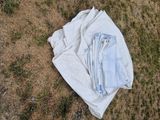 a pile of clothes that is laying on the ground