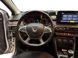 the interior of a car with a steering wheel and dashboard controls