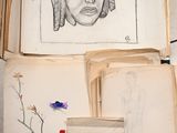 a lot of drawings in a box on the table