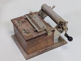 a small machine that is sitting on a white surface