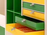brightly colored drawers and shelves in a children ' s playroom