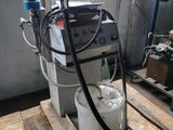 a machine that is sitting on a pallet in a room