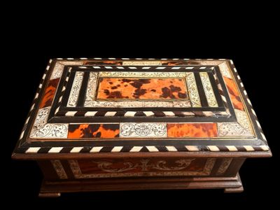 a wooden box that has a design on it