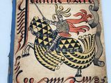 an old book with a picture of a knight riding a dragon