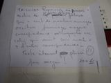 a piece of paper with writing on it sitting on a table