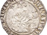 une vieille pièce d'argent surmontée d'une couronne