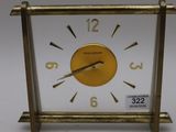 a small clock that is sitting on a table