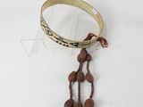 a bracelet with beads hanging from it on a table