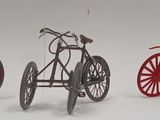 three miniature bicycles that are sitting next to each other