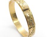 a gold ring with roman numerals on it