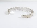 sterling silver bracelet with a star design on the front and a star design on the back