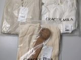three pieces of cloth are wrapped in plastic bags on a table